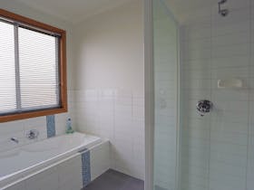 MAIN BATHROOM WITH SEPERATE VANITY ROOM AND TOILET