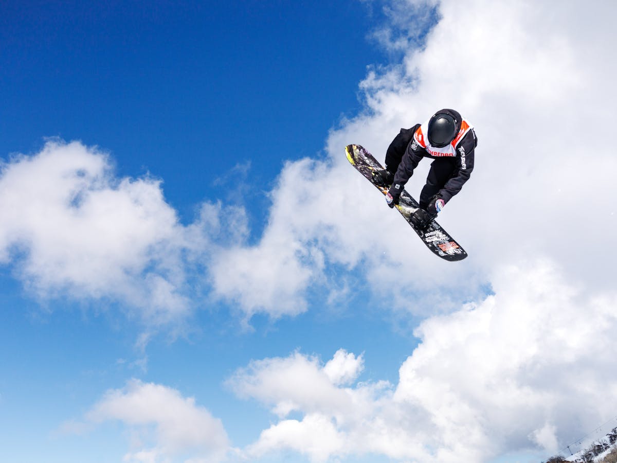 Snowboarder sending it to the moon to take home top spot on the podium.
