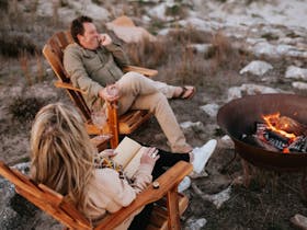 Couple enjoying Firepit on property
