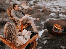 Couple enjoying Firepit on property