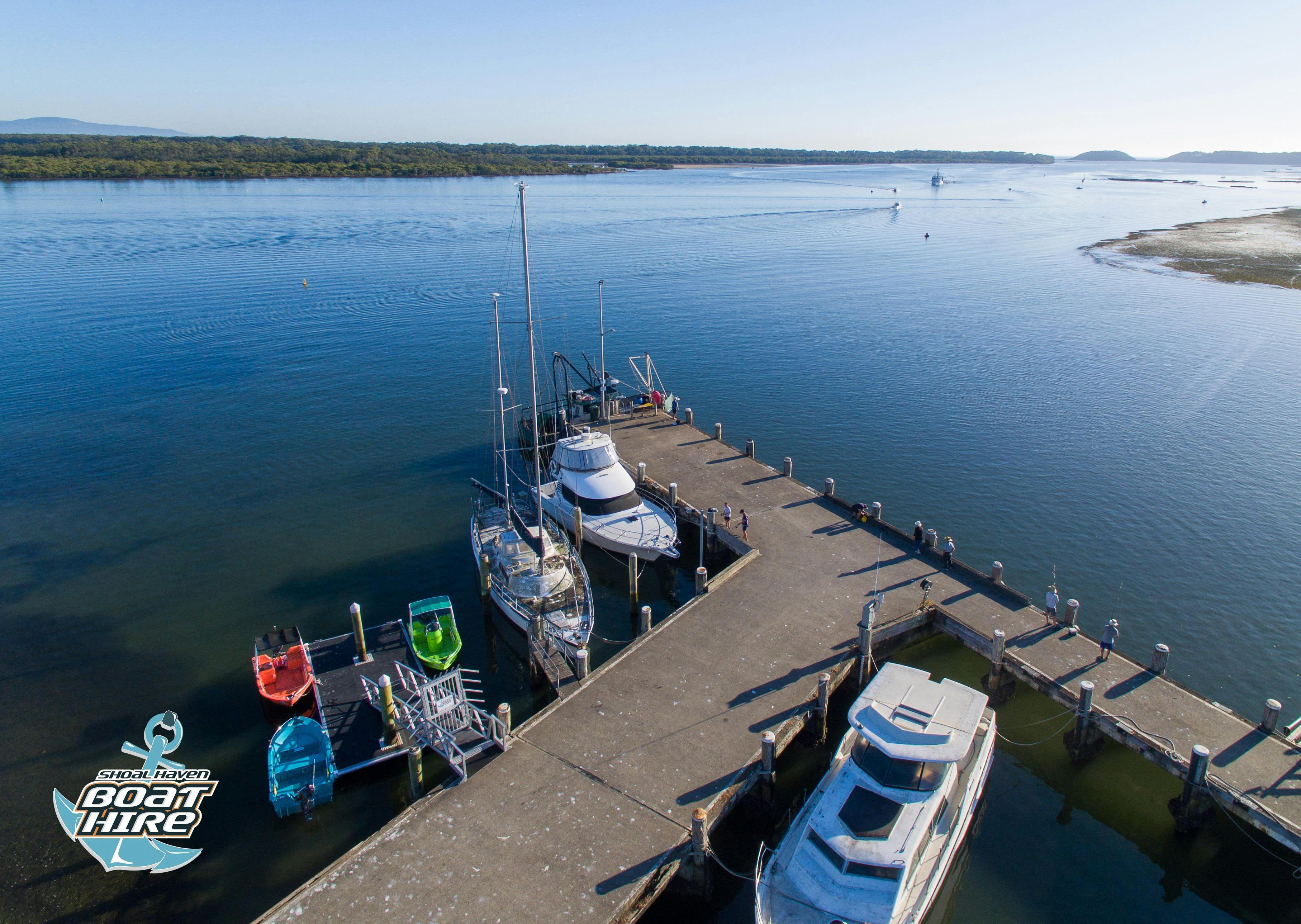 Wharf with boats on river