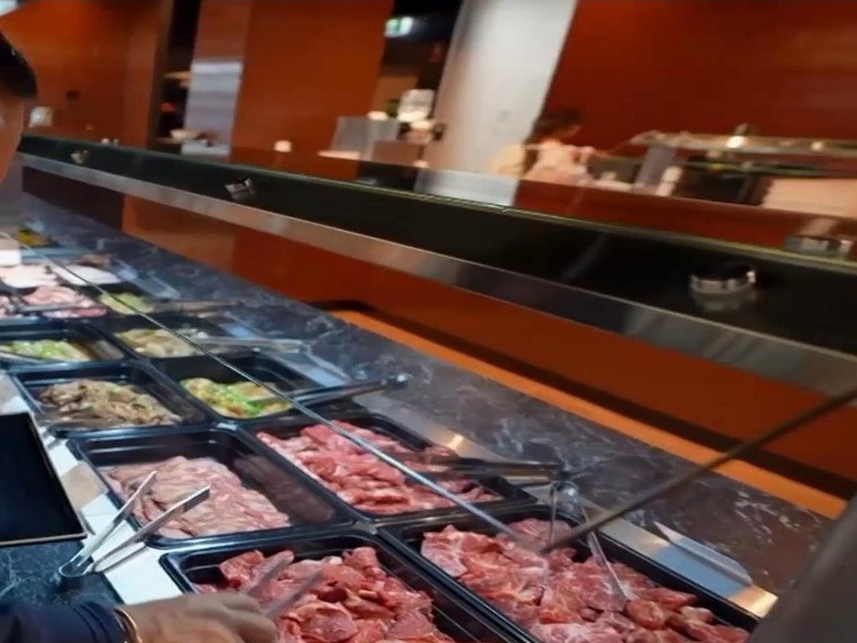 Self-serve meat bar featuring beef, pork, and marinated cuts for Korean BBQ