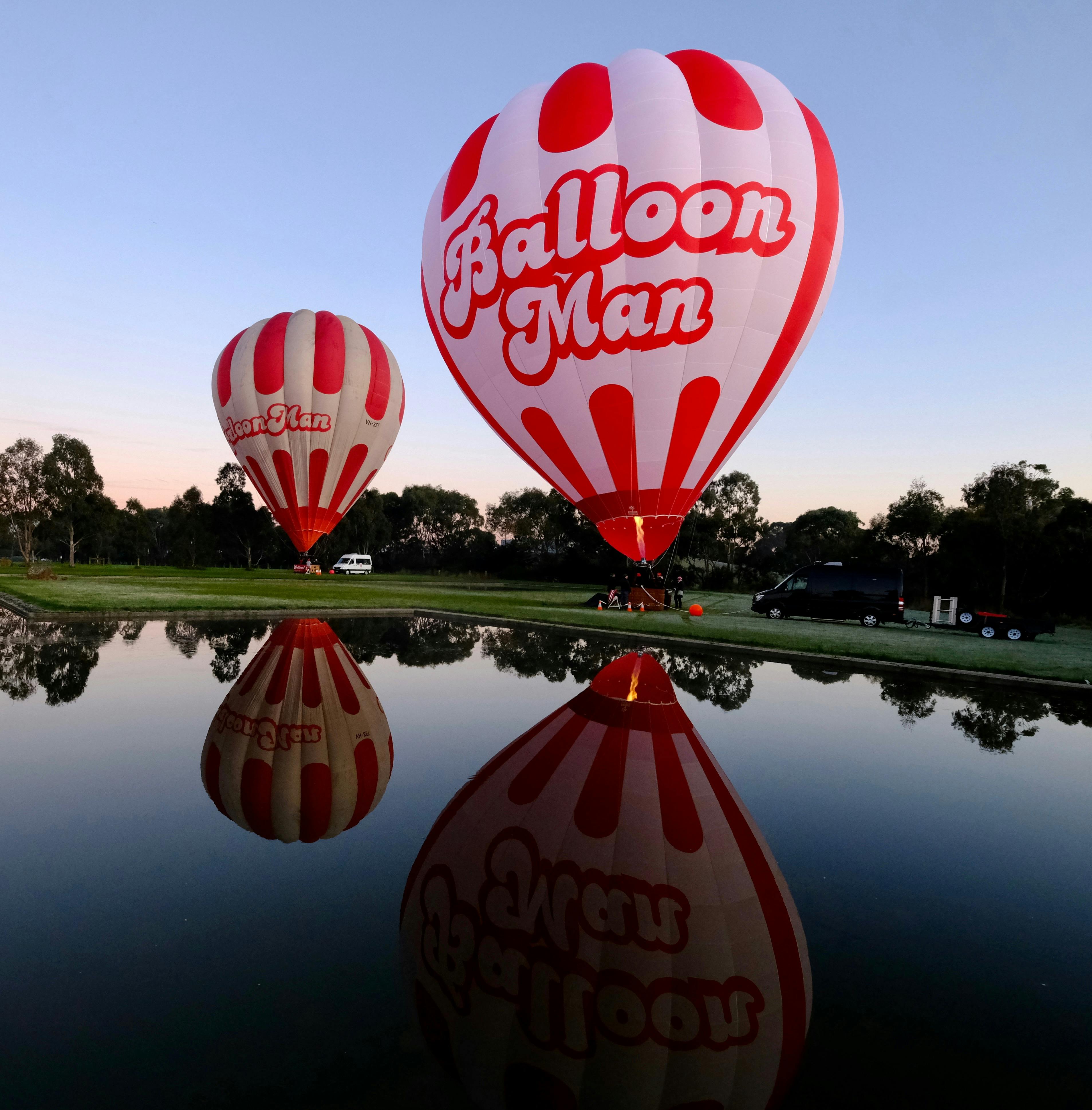 2 BalloonMan balloons reflected in water
