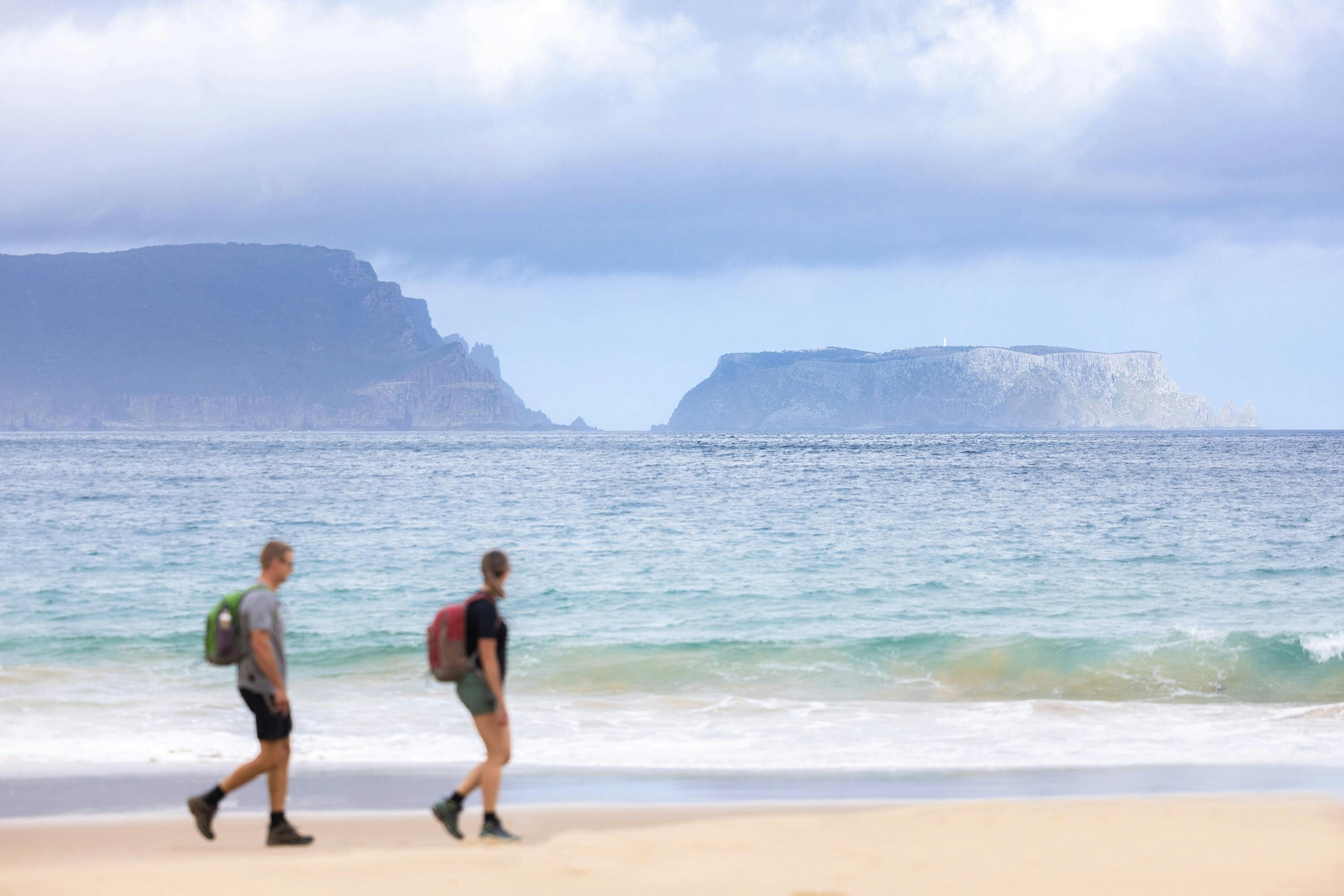 Walking along crescent bay on the Three Capes Long Weekend