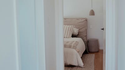 Luxury bedroom down a hall way