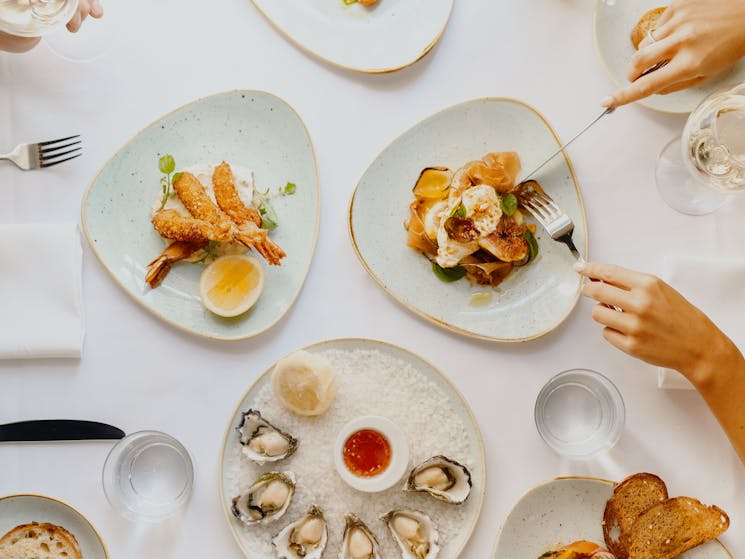 tucking into a table full of food at republic dining