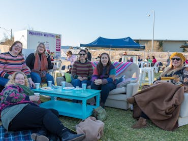 Group enjoying outdoor lounge area, and beverages
