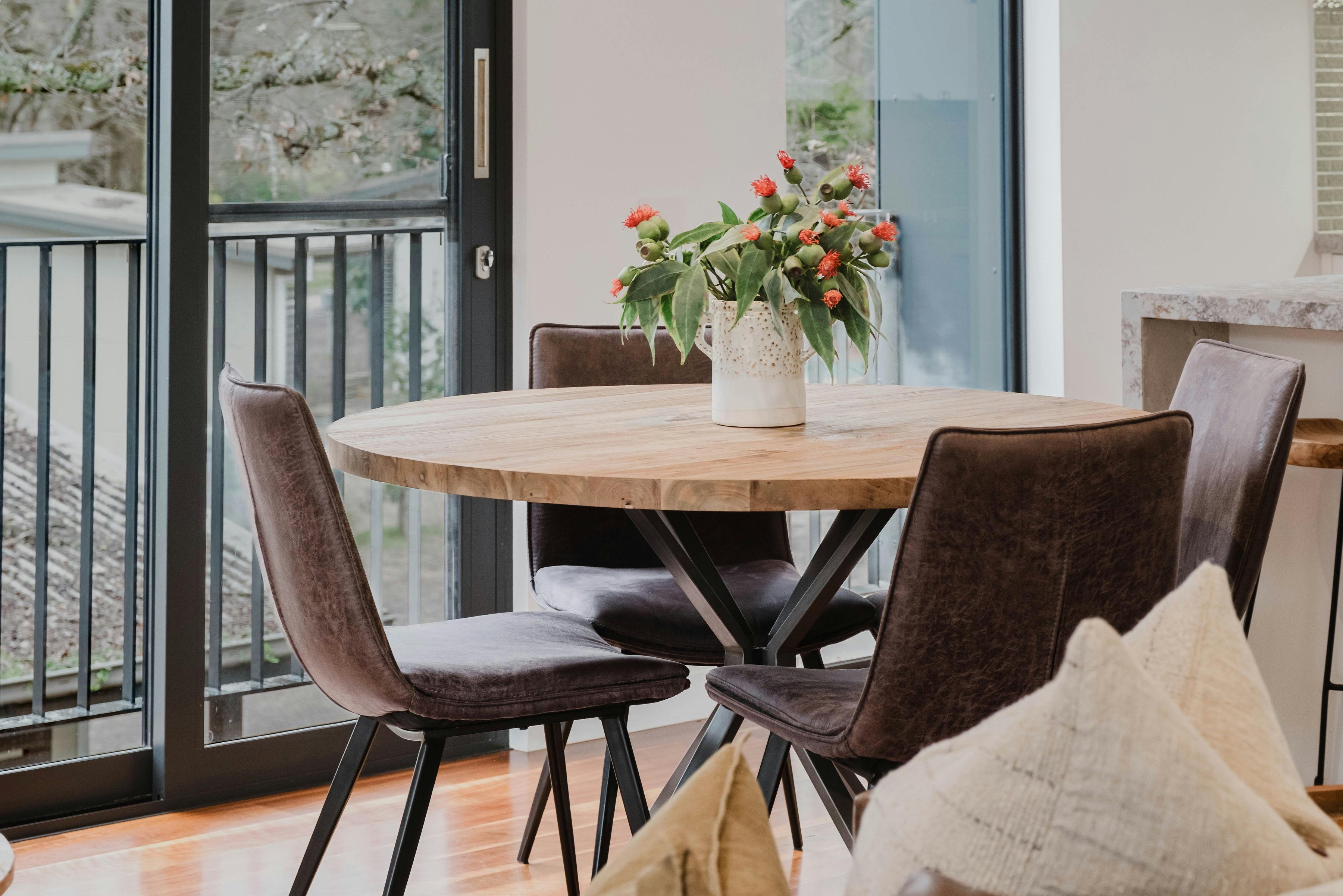 Reed arthouse townhouse dining area with dining table and four chairs