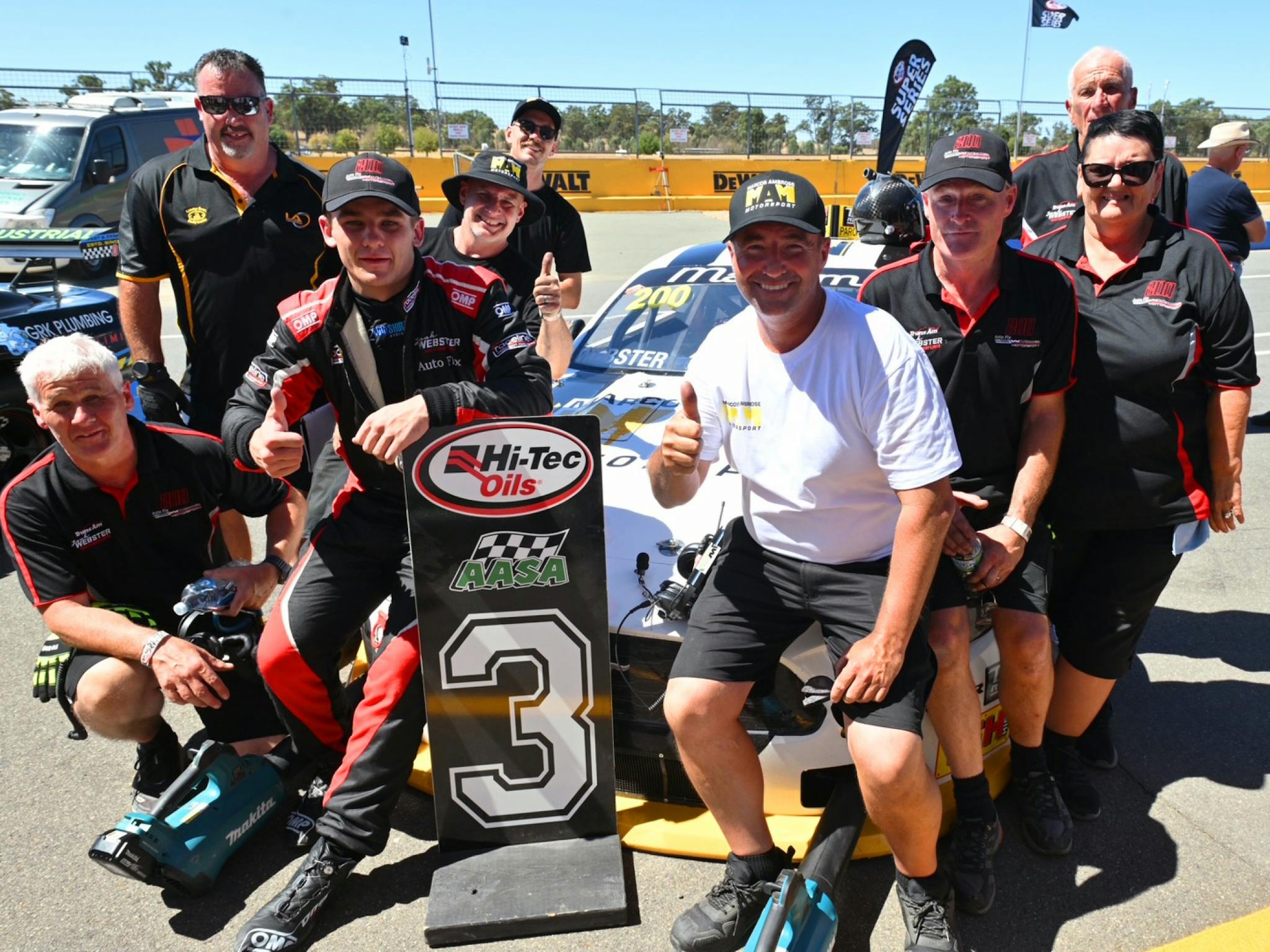 Marcos Ambrose with his Team