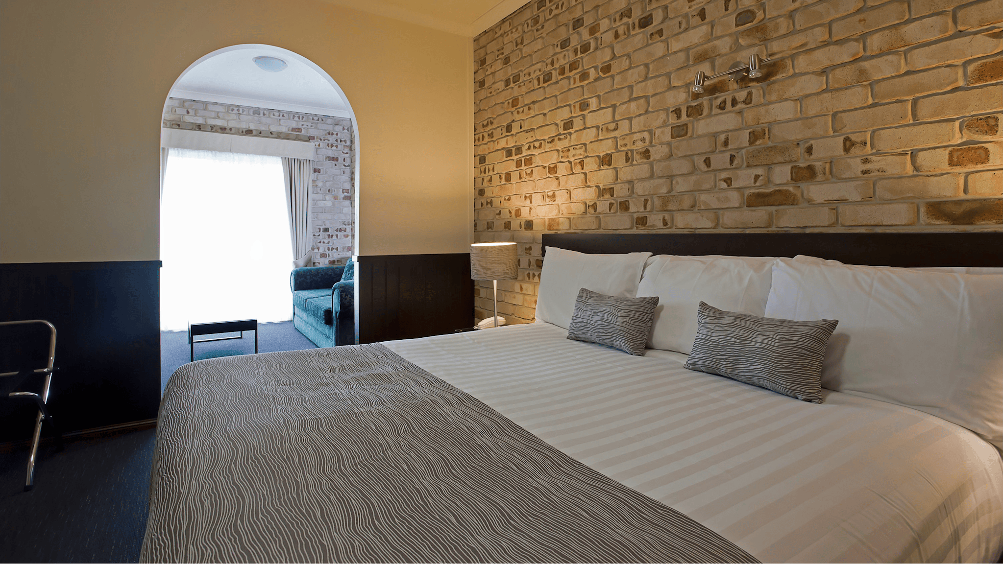 King bed and archway towards spa bathroom King bed and archway towards spa bathroom