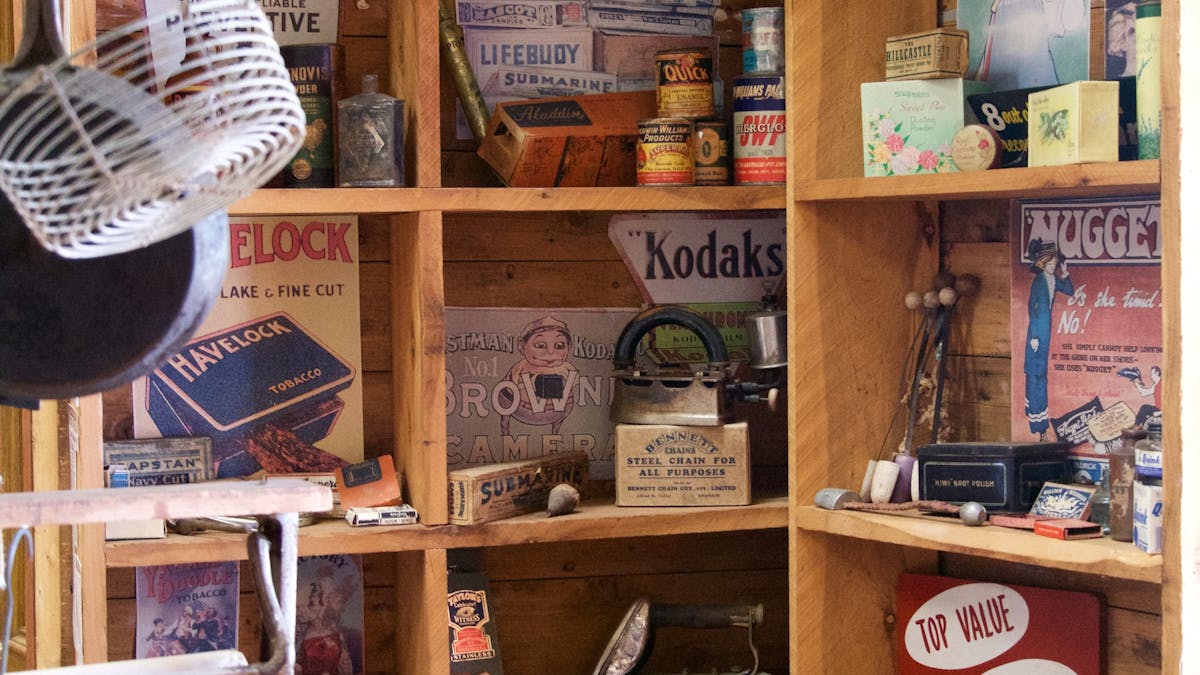 Wooden shelving lined with vintage shop products