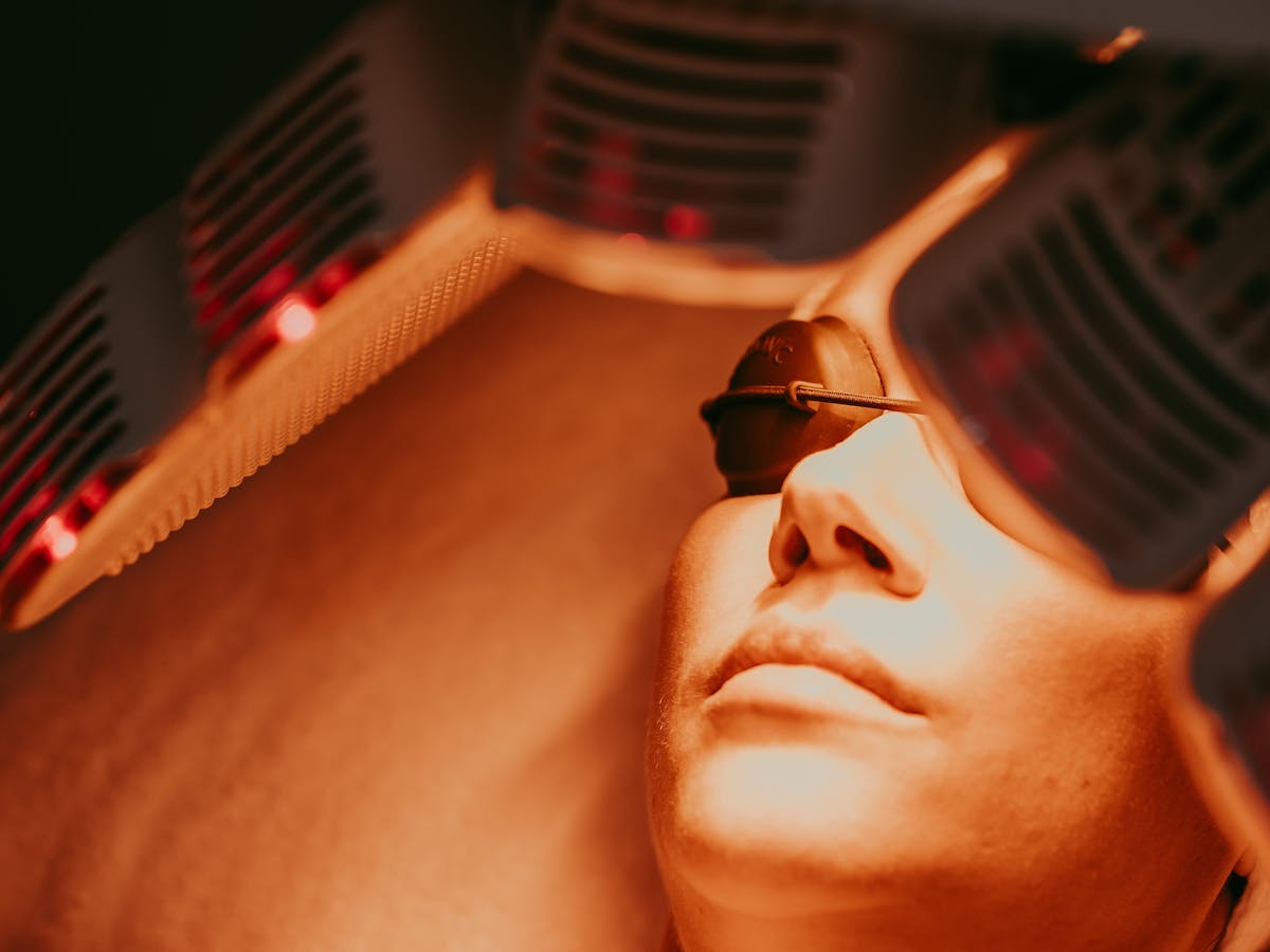LED light therapy being used on a patient during a facial