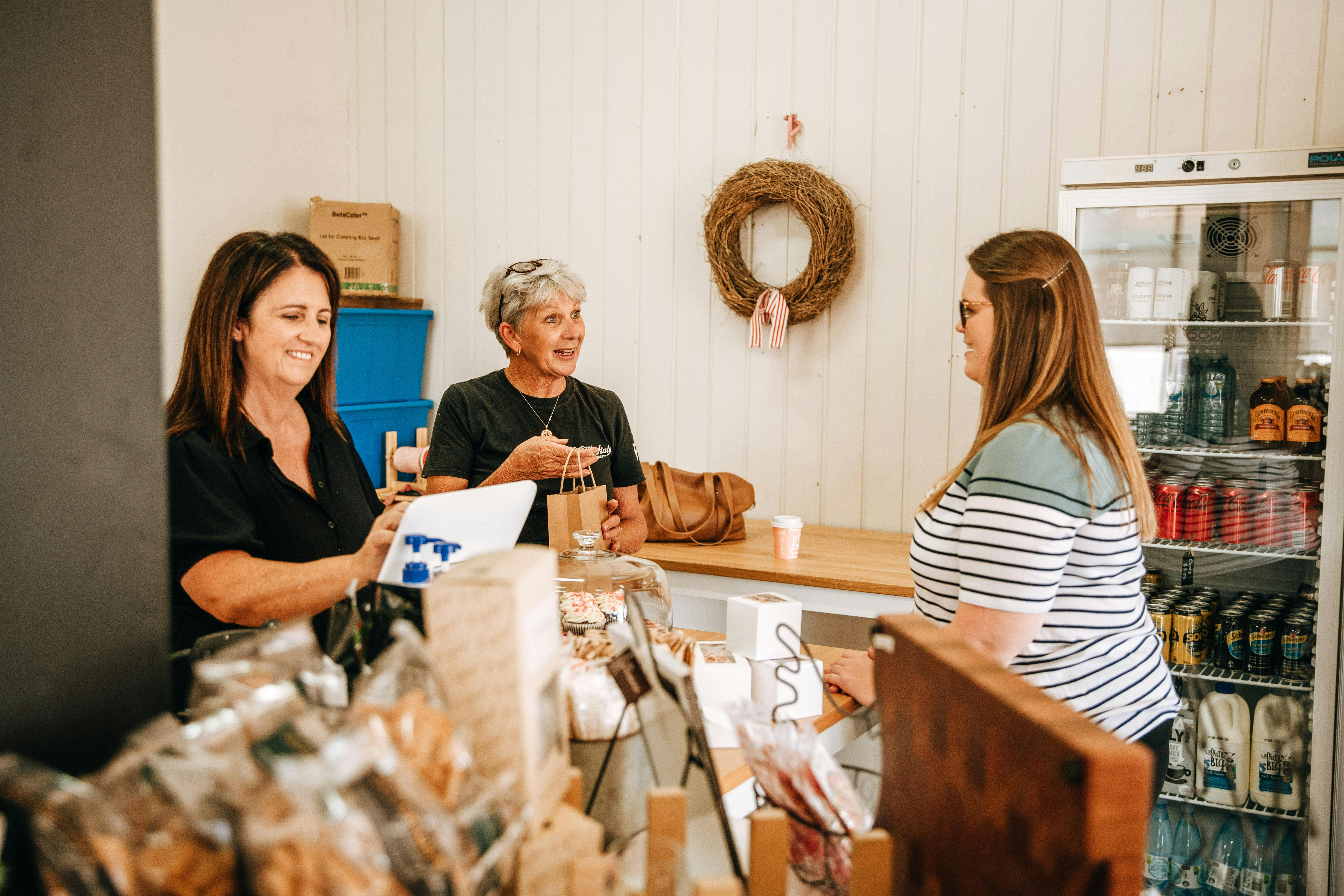 Customer being served by friendly cafe workers