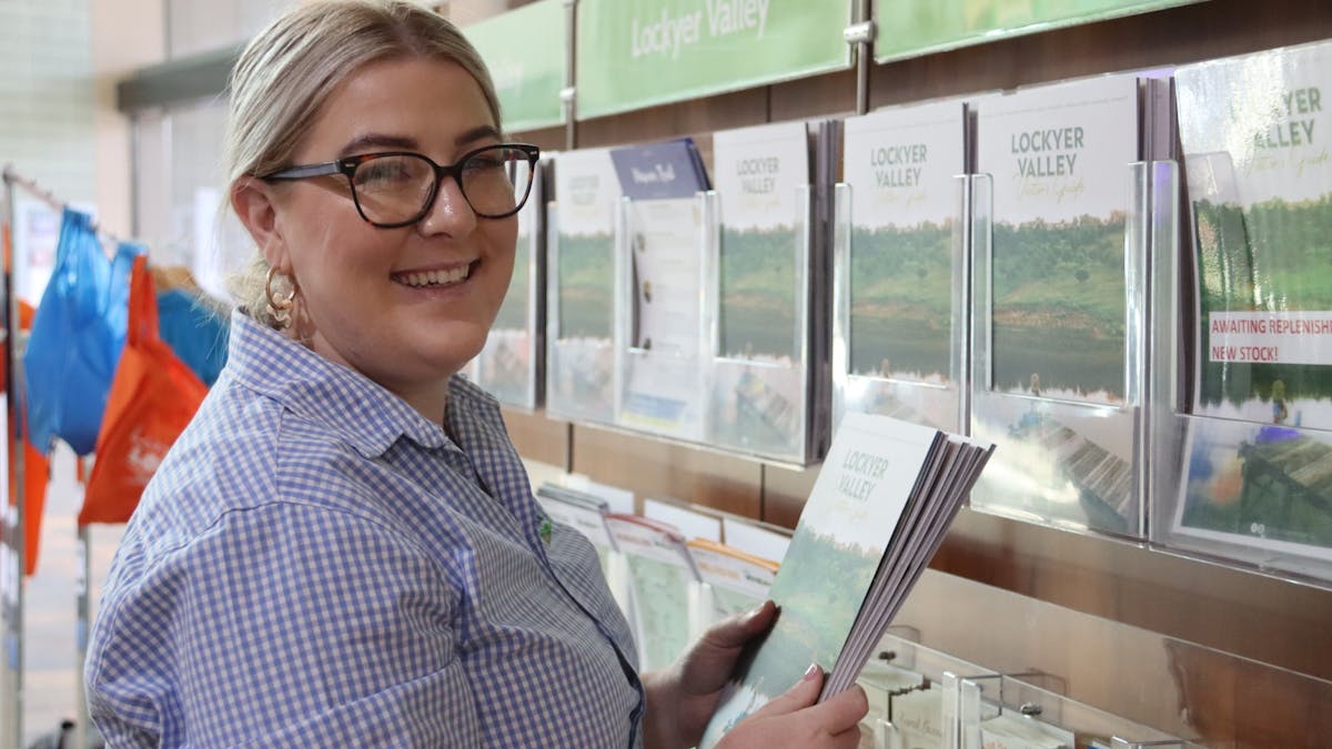 Staff member sharing visitor guide