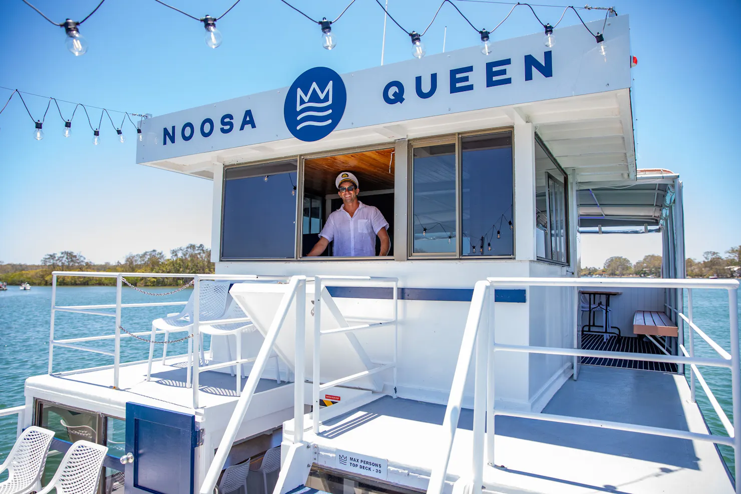 The Noosa Queen with Captain Dan at the helm