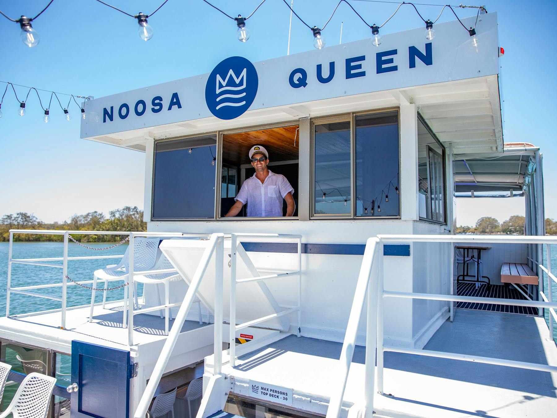 The Noosa Queen with Captain Dan at the helm
