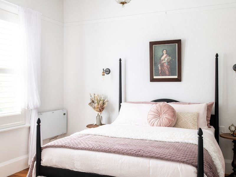 Styled in soft pinks and greys with unique antique and vintage decor.
