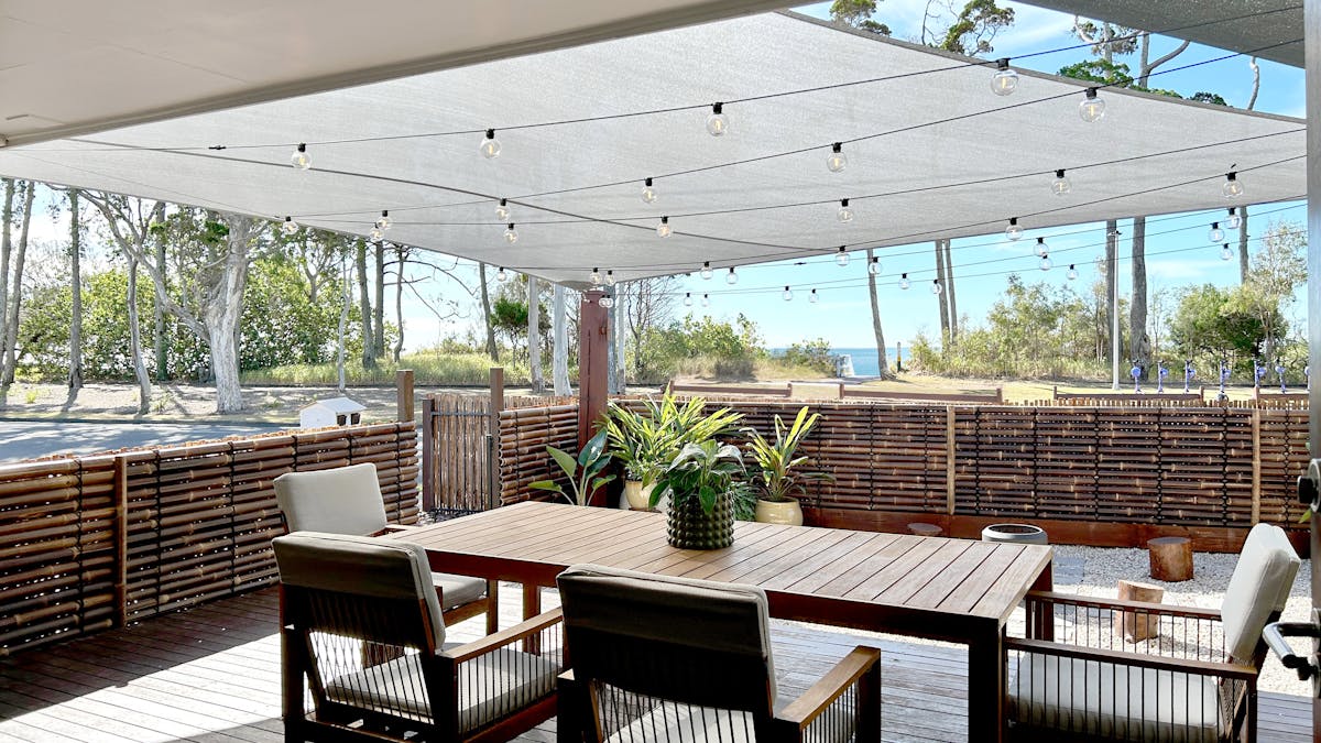 Enjoy ocean views from the beautiful timber deck, featuring a 6 seater dining