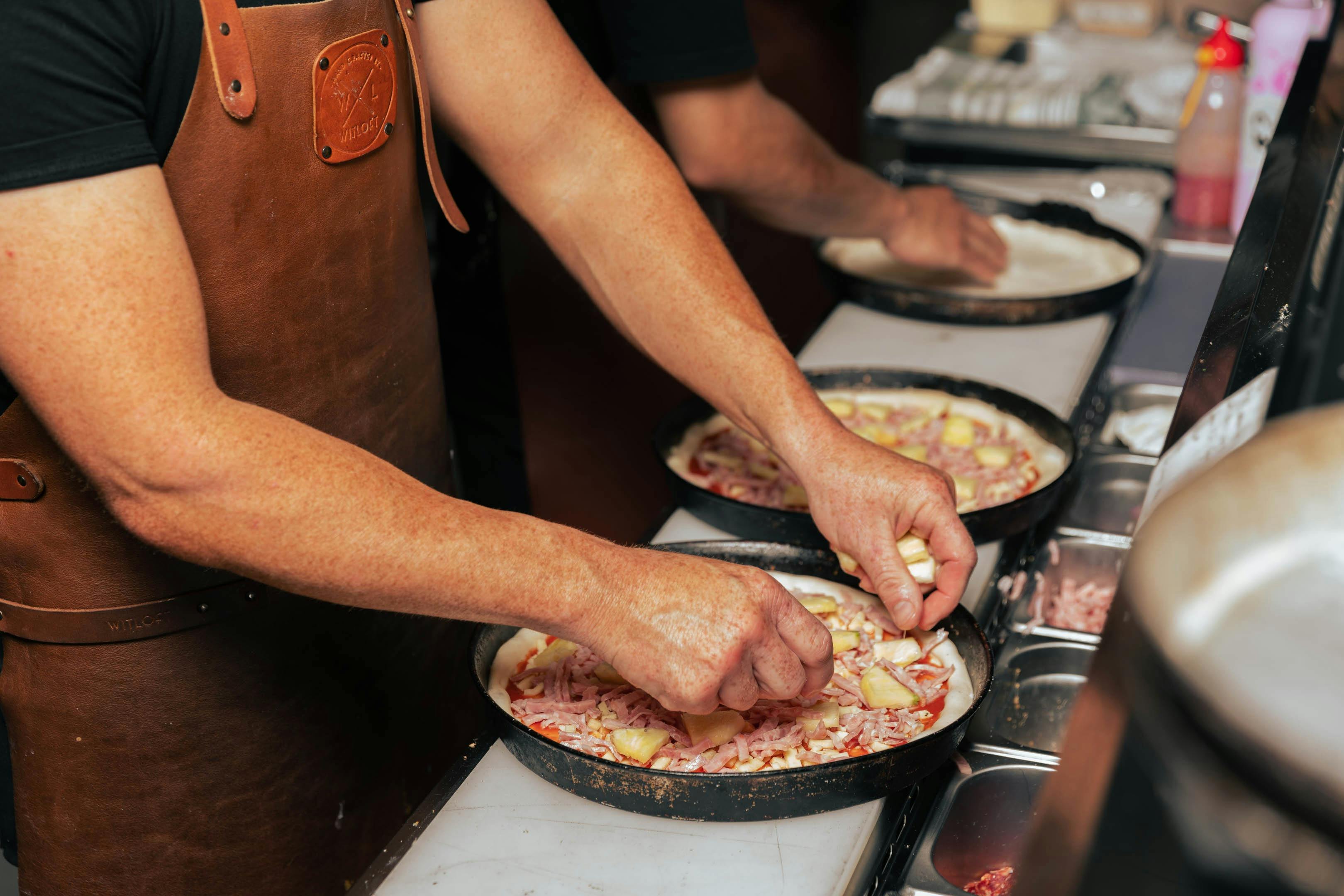 Pizza chef making pizzas