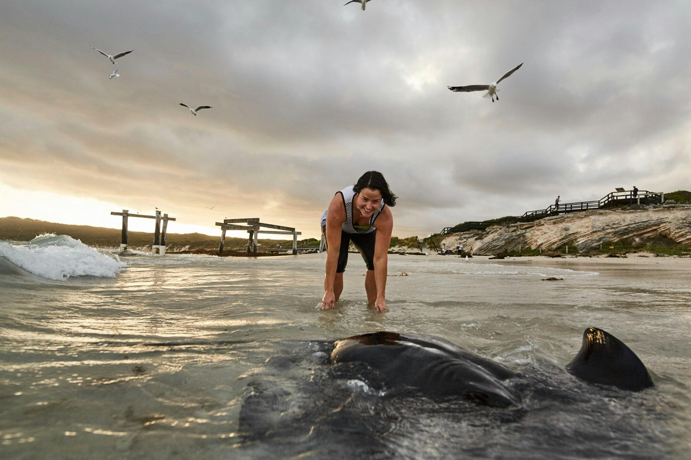 Lady in the water with a stingray at Hamelin Bay