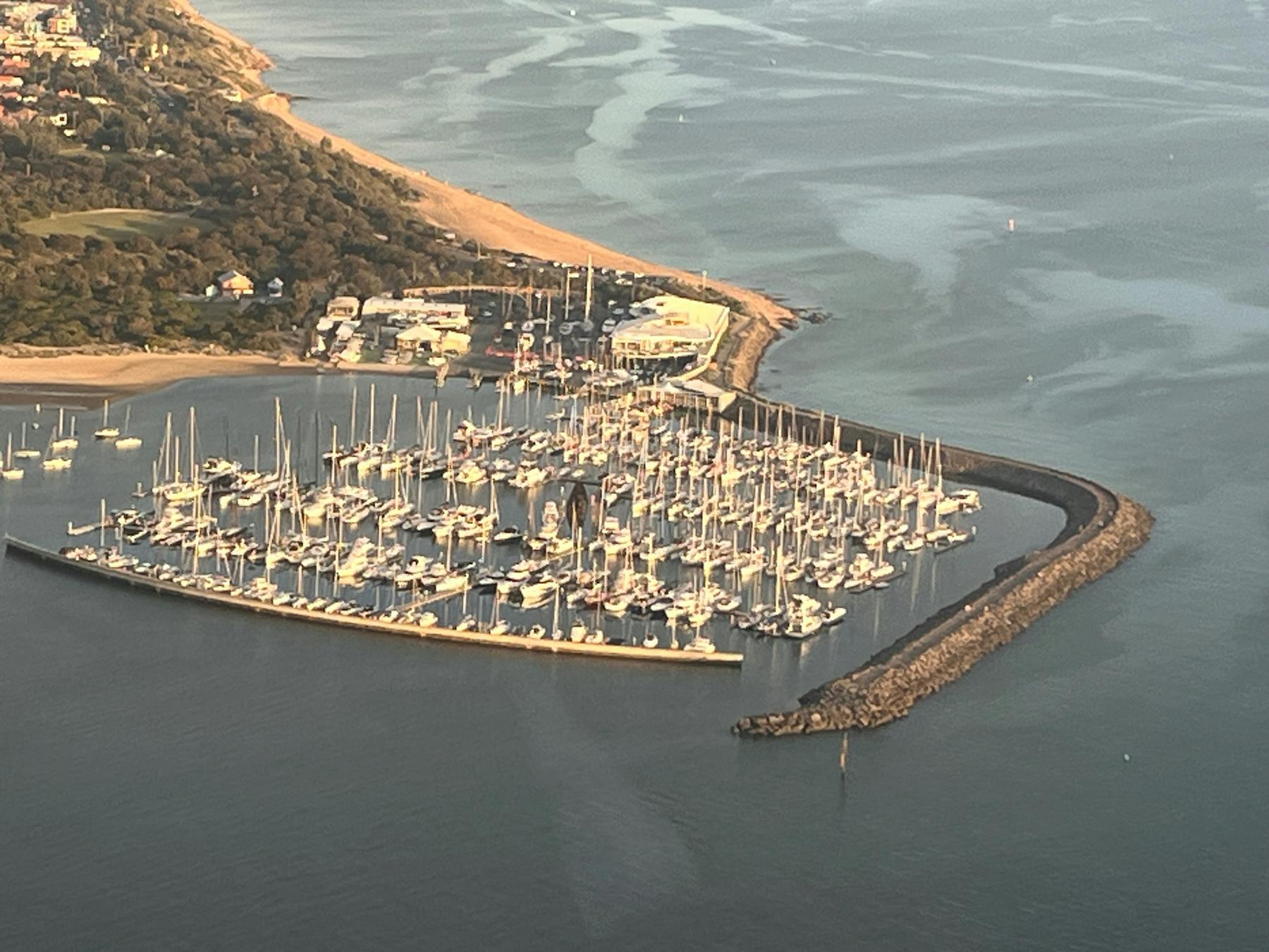 Helicopter ride over melbourne looking onto a marina with boats