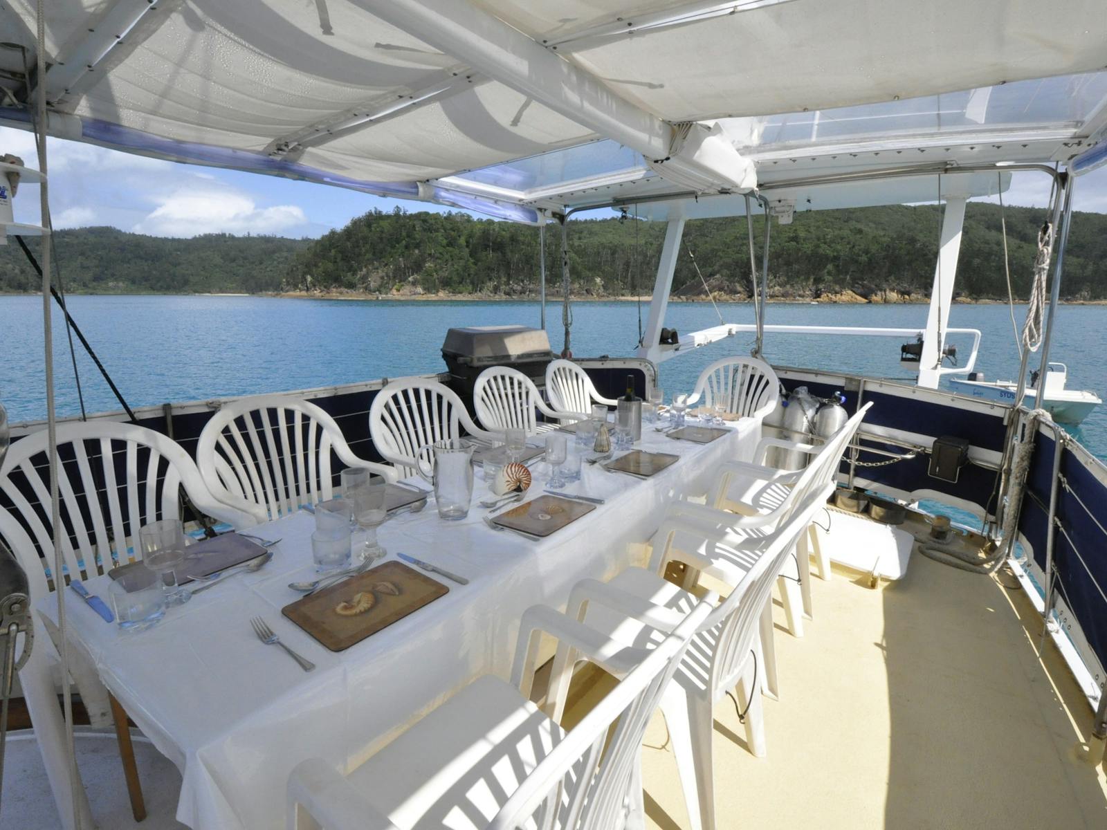Dining table set up for 10 guests aboard Australia's most awarded charter yacht "Sydney Sundancer"