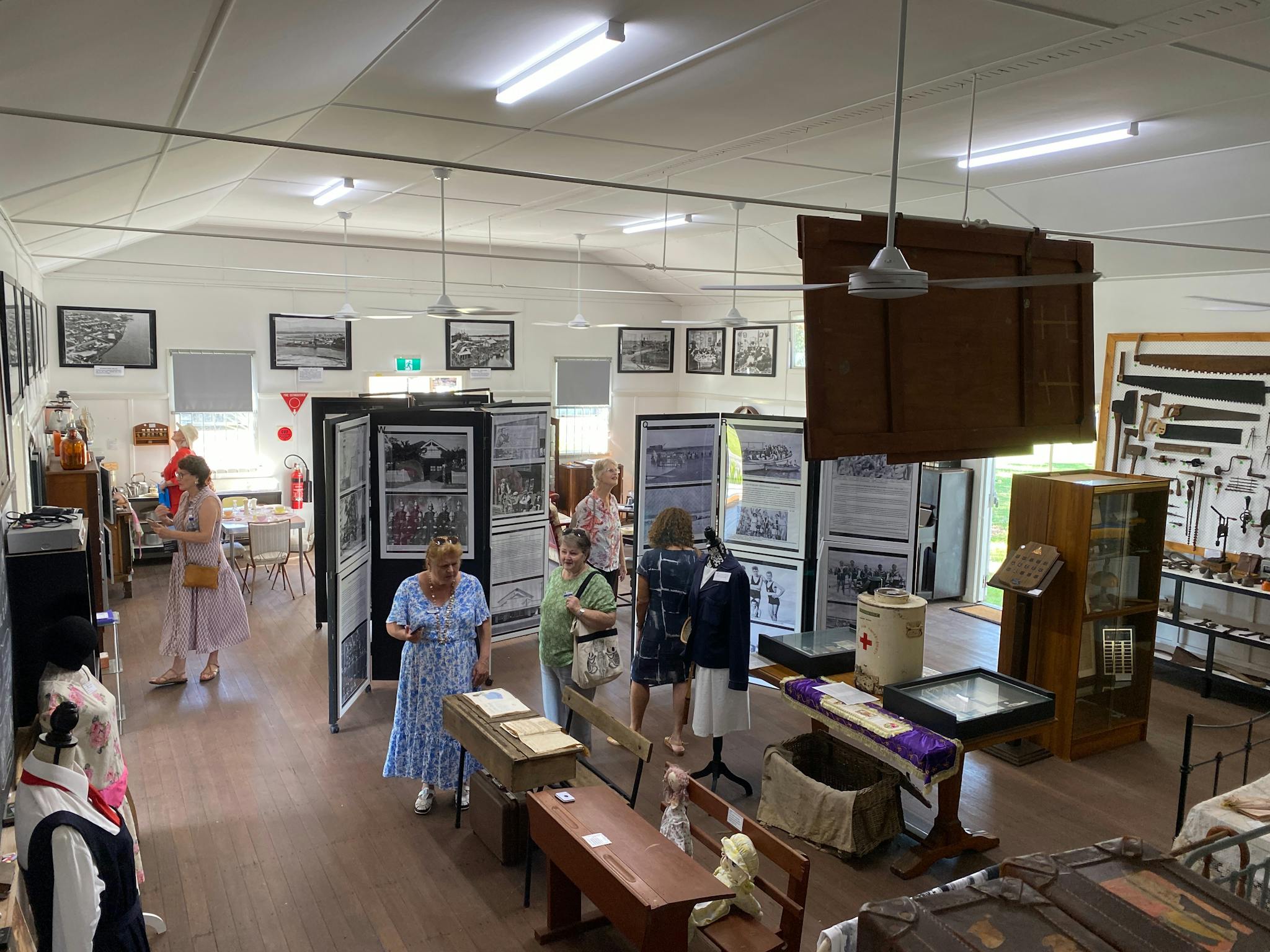 Interior photo of the museum taken from above with people looking at displays