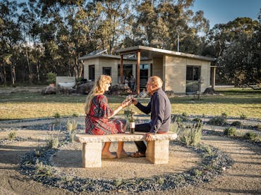 A couple enjoying an extra night at Earth & Soul Retreat on the Granite Belt, Southern Queensland