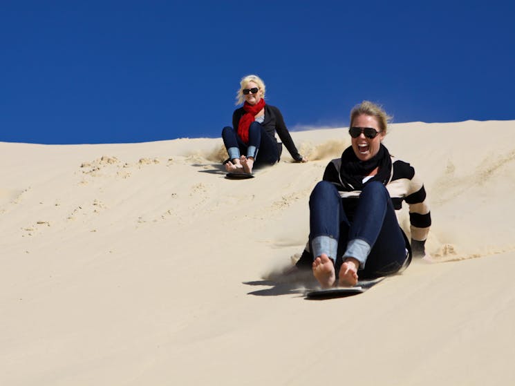 Sandboarding on the dunes at Port Stephens