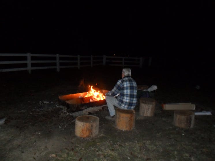 Enjoy the warmth from the firepit made from recycled products on a crisp evening.