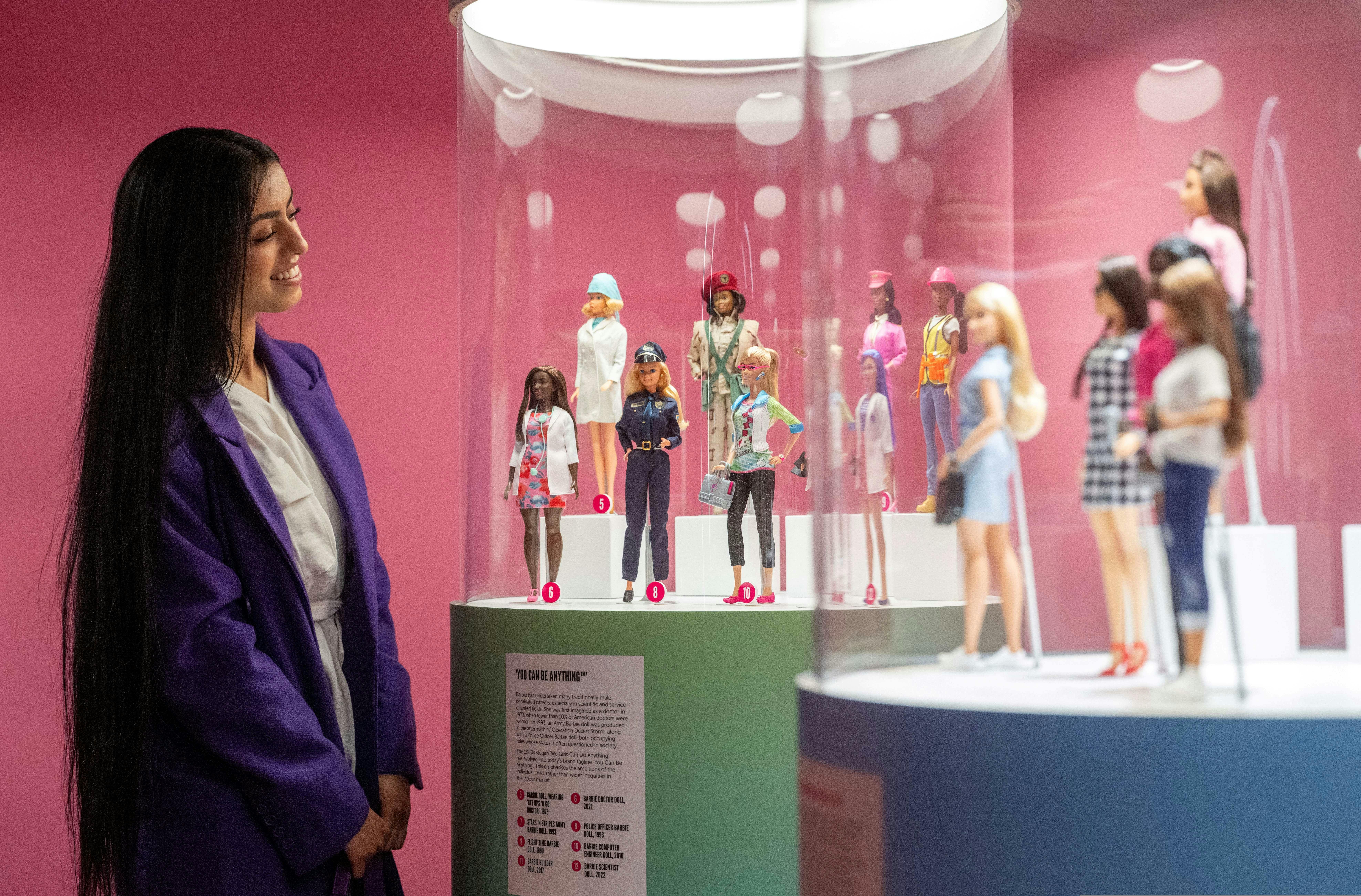 Person exploring Barbie: The Exhibition .