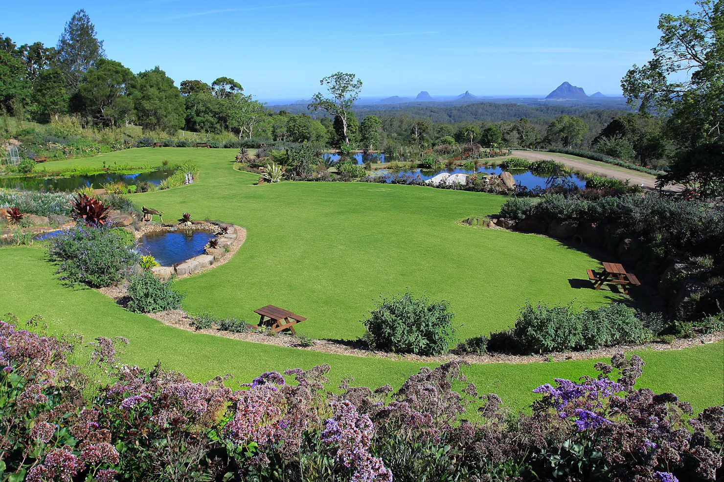 Waterfalls, ponds and stunning Glasshouse Mountain views create an awesome experience