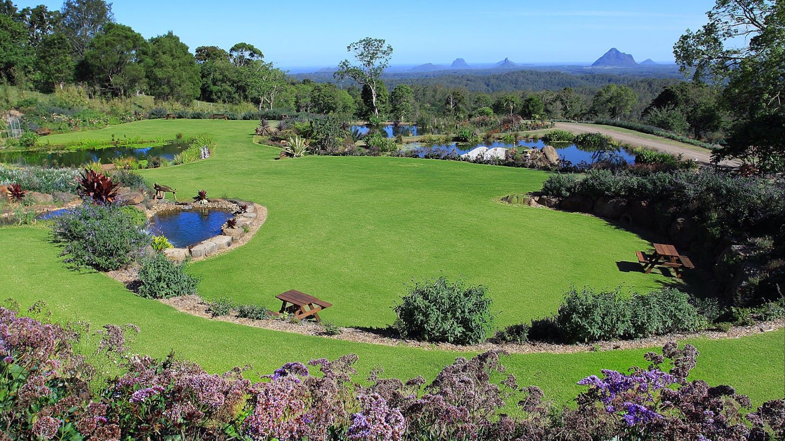Waterfalls, ponds and stunning Glasshouse Mountain views create an awesome experience