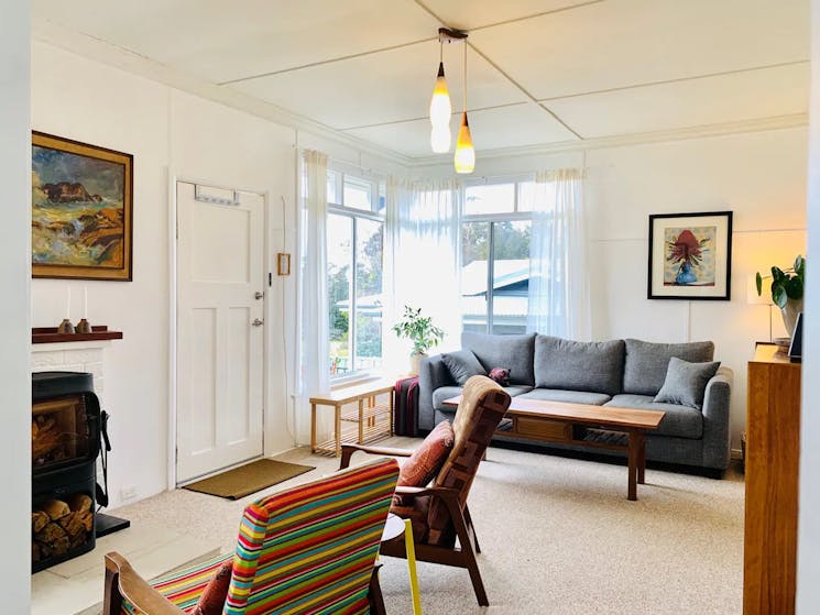 The cottage offers a cosy, retro-style interior with a mix of new and old.