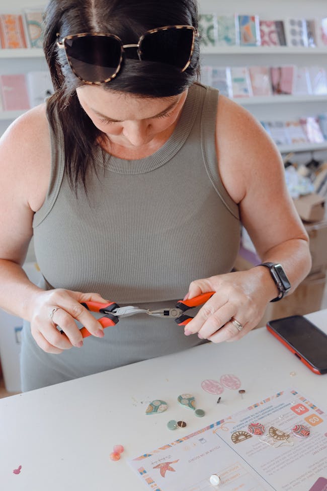 a lady making earrings