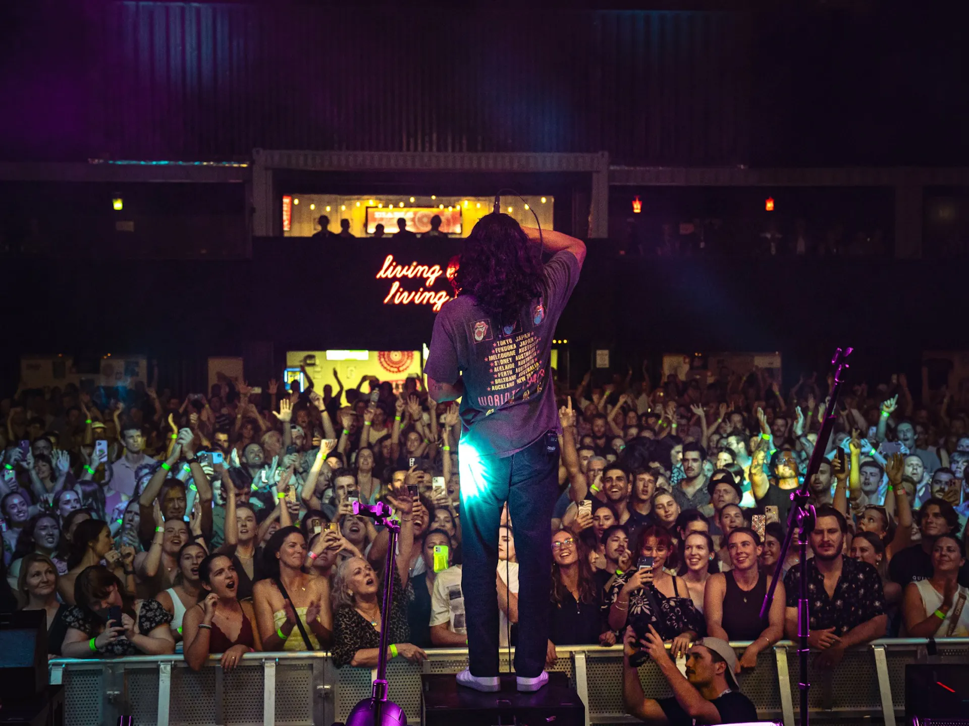 A photo of a crowd at a concert from the stage point of view.