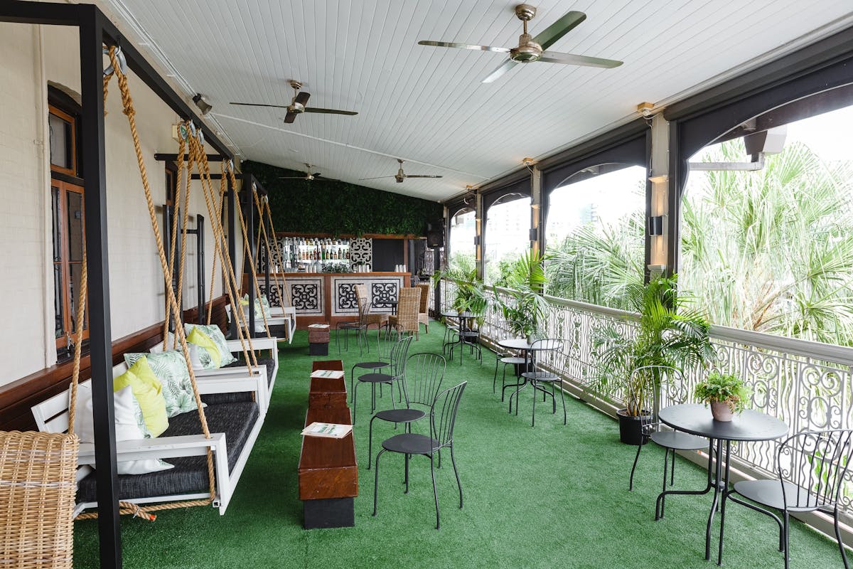 Outside dining area with swinging day beds