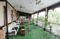 Outside dining area with swinging day beds