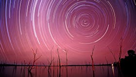 Stair trails on pink sky over Lake Nuga Nuga.