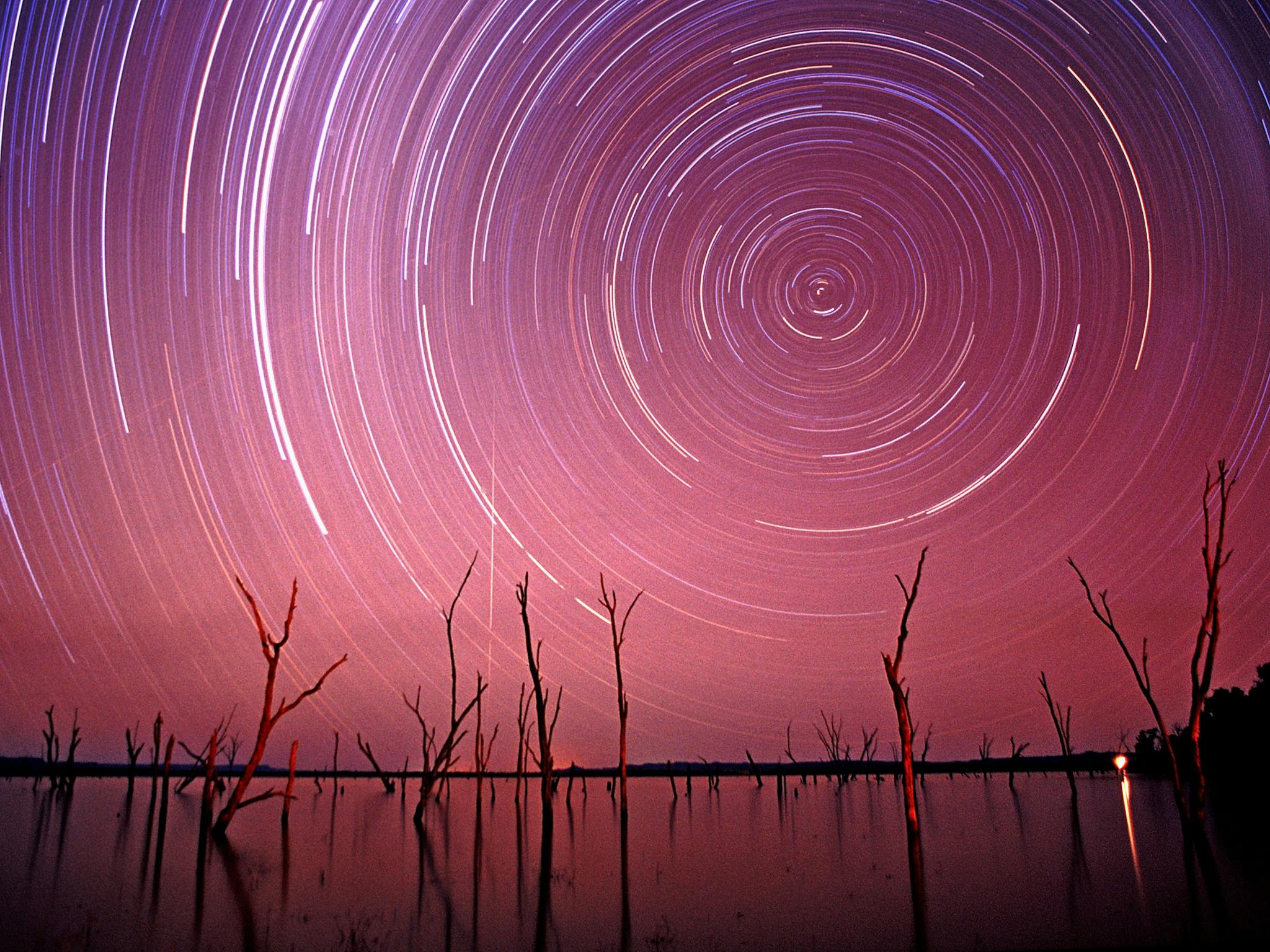 Stair trails on pink sky over Lake Nuga Nuga. Stair trails on pink sky over Lake Nuga Nuga.