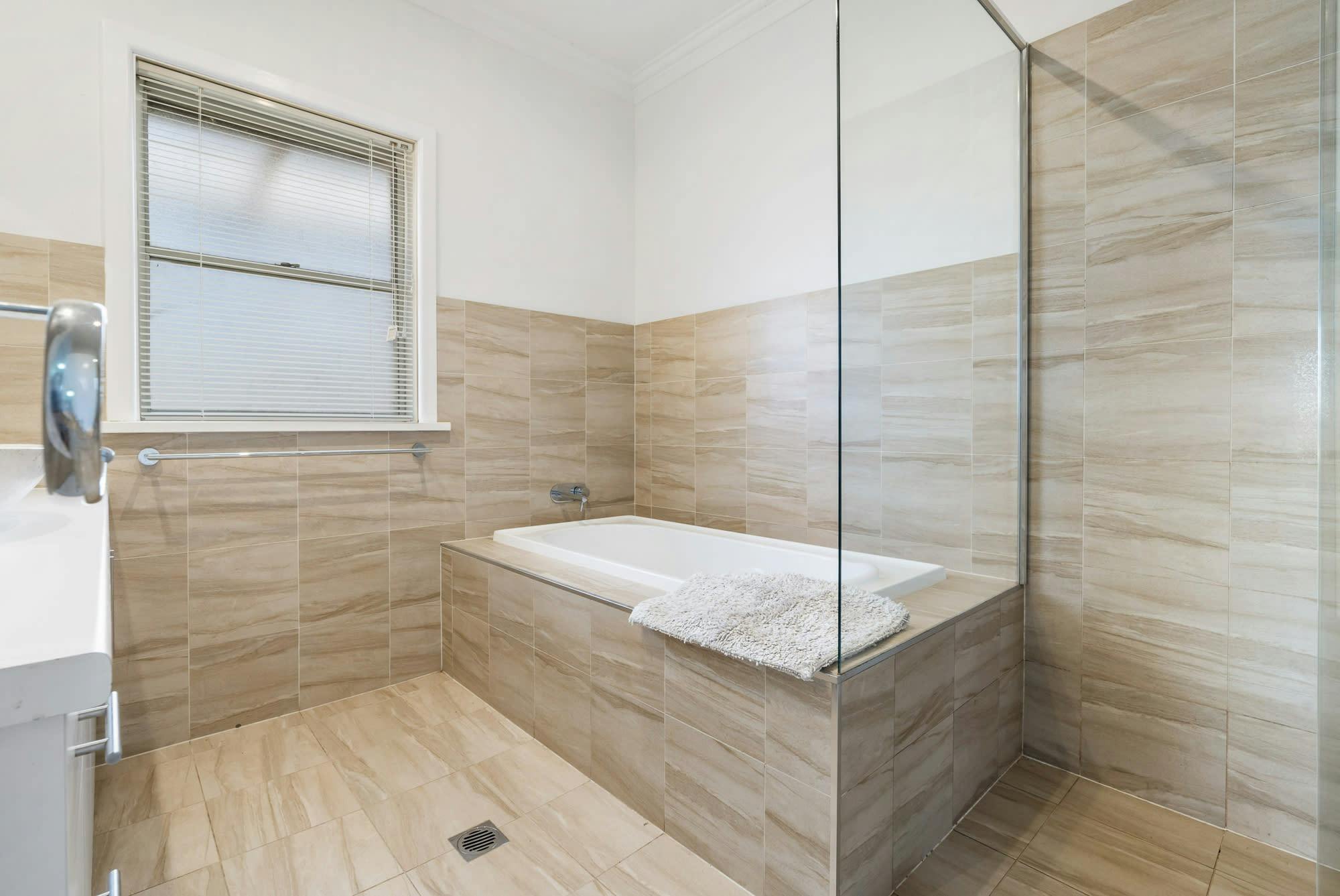 Bathroom with bath and shower
