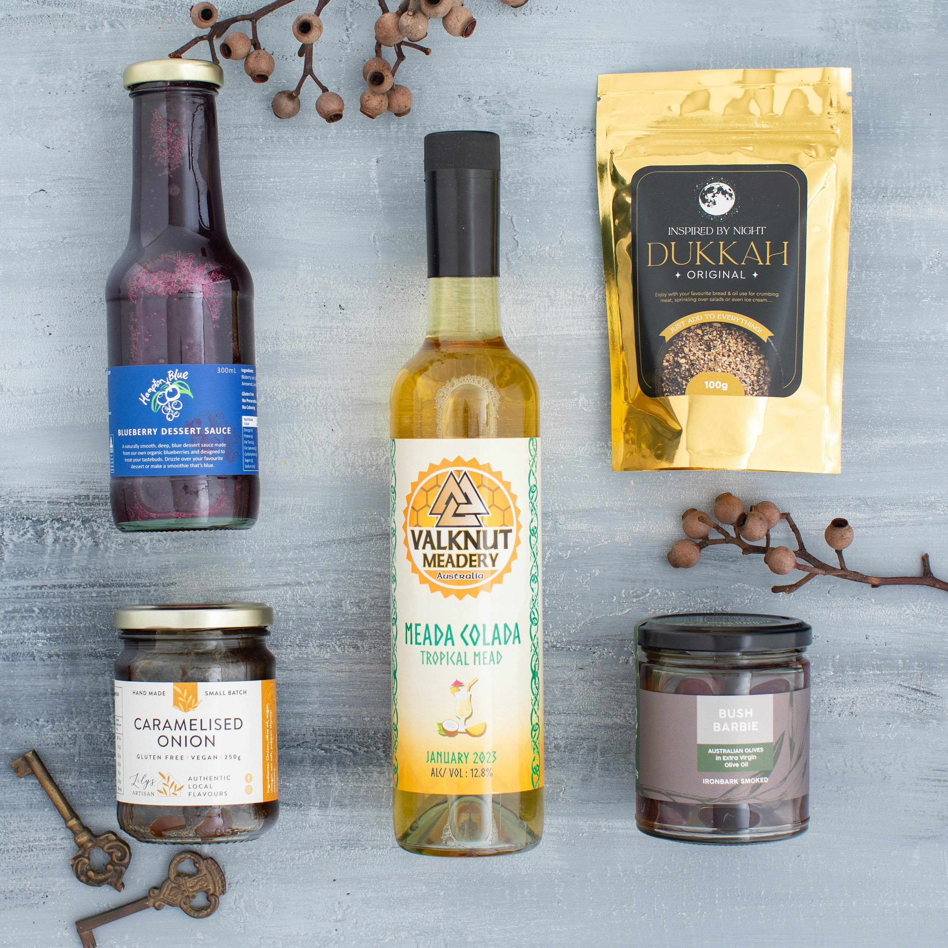 This hamper features Mead, marinated olives, dukkah, coulis and lots more