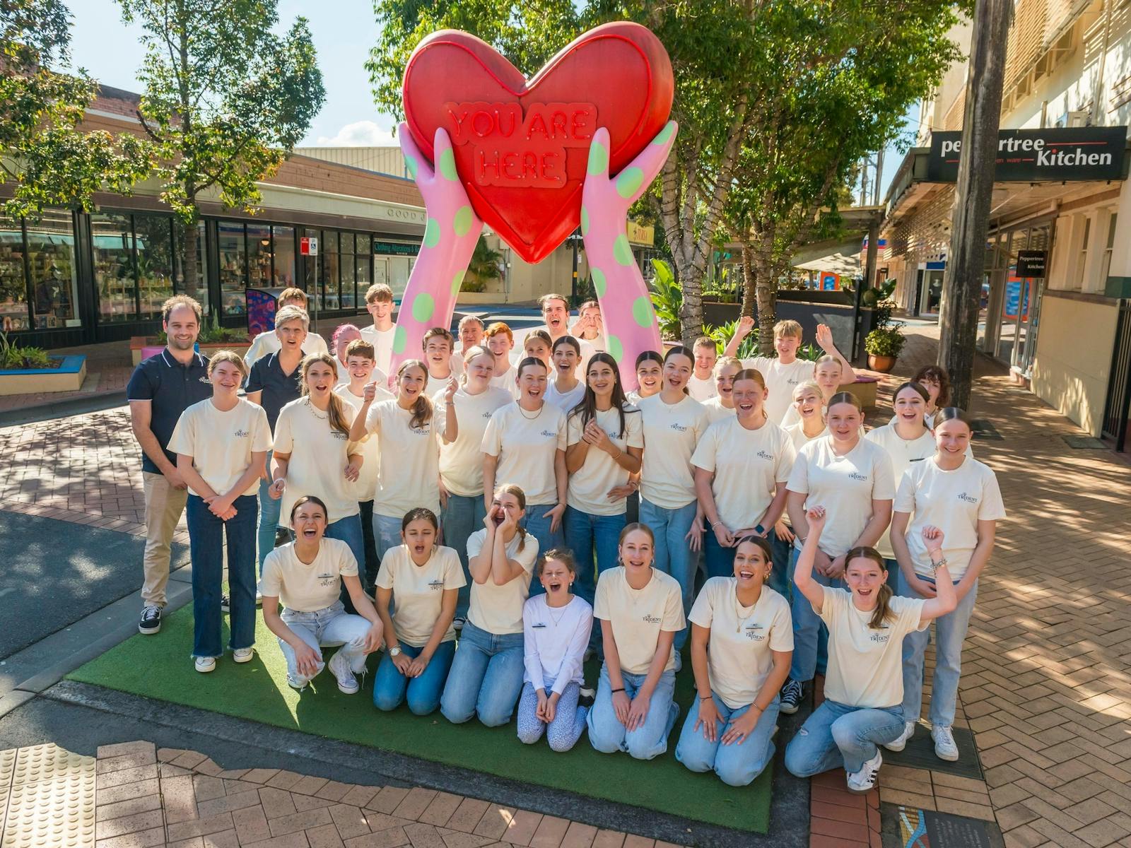 Triden'ts Friendly team in front of the 'You are Here' heart in Lismore