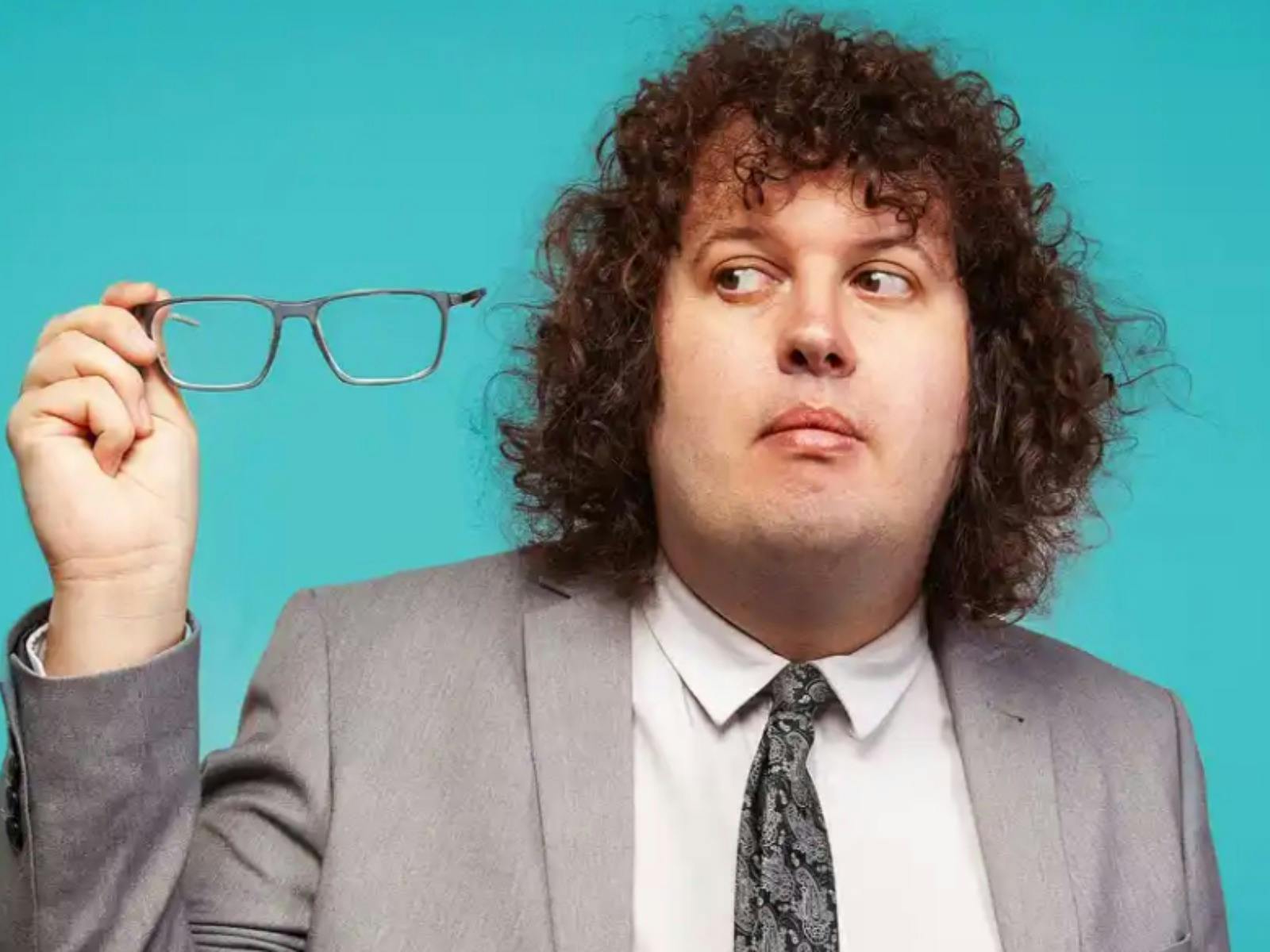 A portrait of Ray O'Leary with a blue background