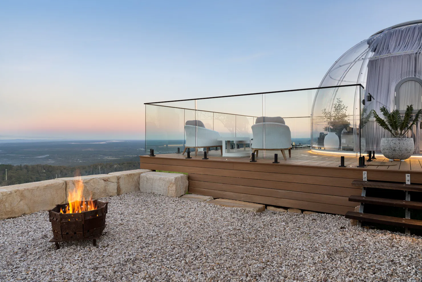 The Magical Dome outdoor area with a spa & firepit