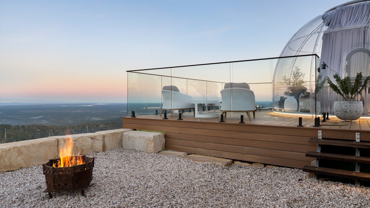 The Magical Dome outdoor area with a spa & firepit
