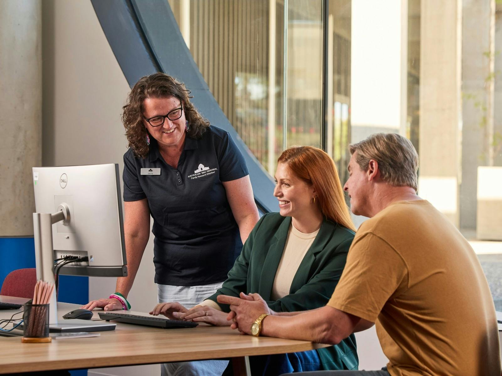 Research Centre Volunteer talking to visitors at the Charles Bean Research Centre