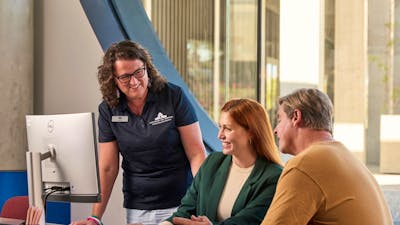 Research Centre Volunteer talking to visitors at the Charles Bean Research Centre