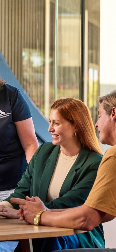 Research Centre Volunteer talking to visitors at the Charles Bean Research Centre
