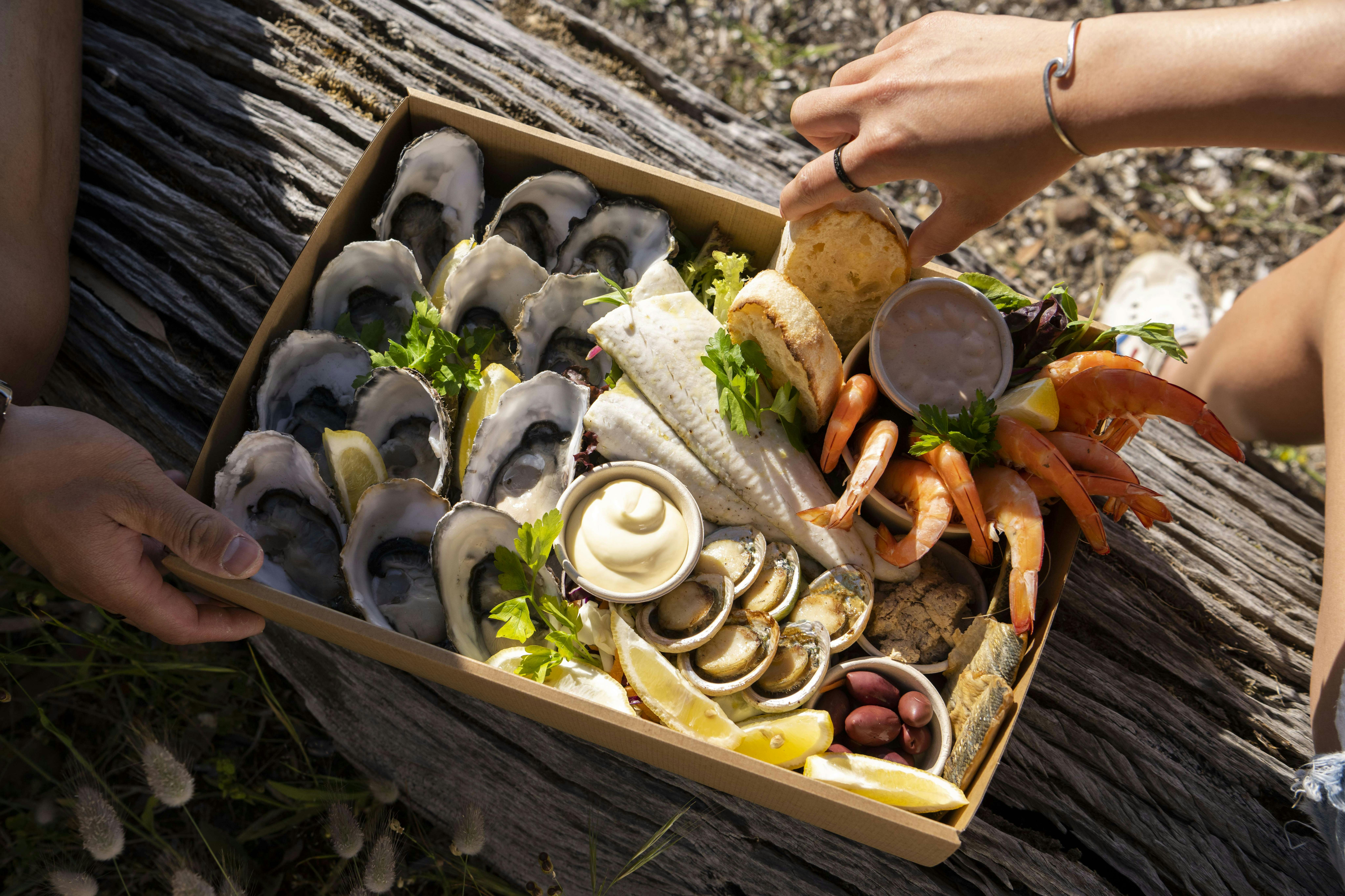 Aquaplatter with hands removing food